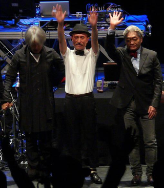 Haruomi Hosono (right) with Yellow Magic Orchestra in 2008. (Photo: Wikipedia/The_Junes)